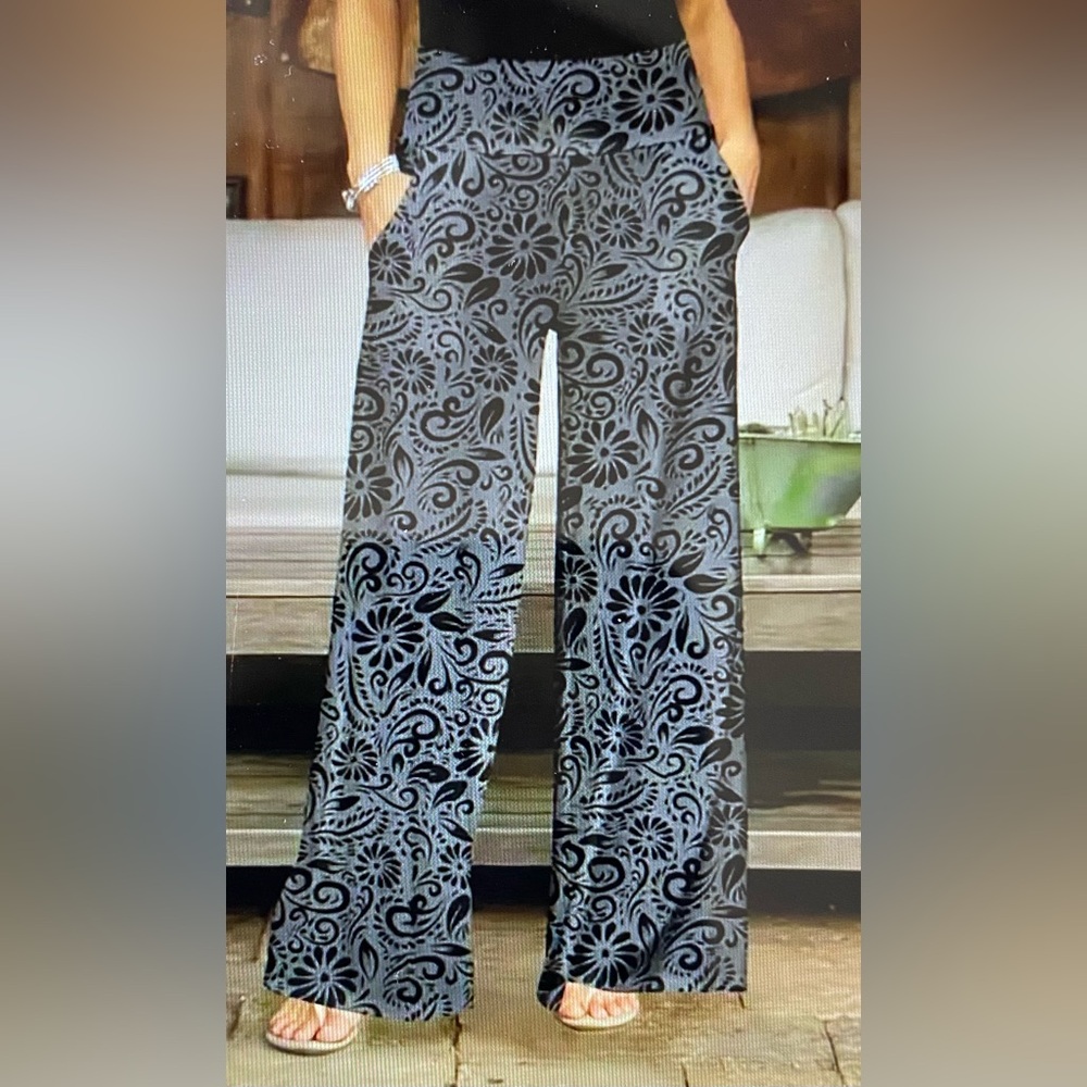 Paisley, floral wide leg pants. Polyester elastane. Has stretch. Silky